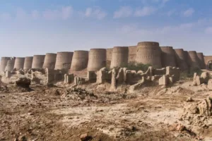 Cholistan Desert features ancient mud-brick fortifications against a clear sky.