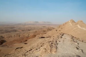 Negev Desert landscape with rocky hills and expansive arid terrain.