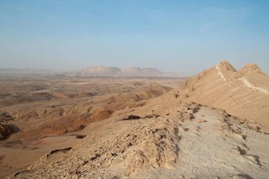 Negev Desert landscape with rocky hills and expansive arid terrain.